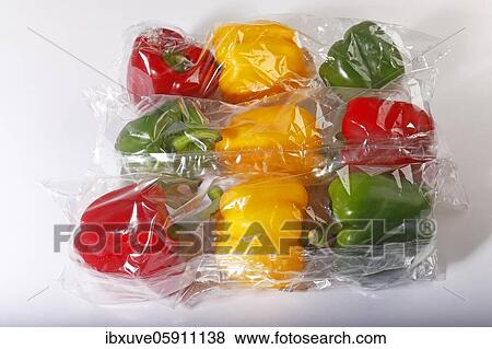 Red, yellow and green peppers (Capsicum annuum) from the supermarket shrink-wrapped in plastic, vegetables in plastic packaging, plastic waste, studio recording, Germany, Europe View Large Photo Image Stock Photo - Red, yellow and green peppers (Capsicum annuum) from the supermarket shrink-wrapped in plastic, vegetables in plastic packaging, plastic waste, studio recording, Germany, Europe. Fotosearch