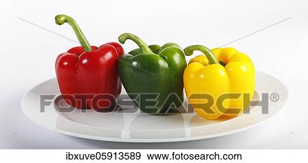Stock Photo - Red, yellow and green peppers (Capsicum annuum), vegetables, studio recording, Germany, Europe. Fotosearch