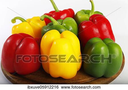 Stock Photograph - Red, yellow and green peppers (Capsicum annuum), vegetables, studio recording, Germany, Europe. Fotosearch