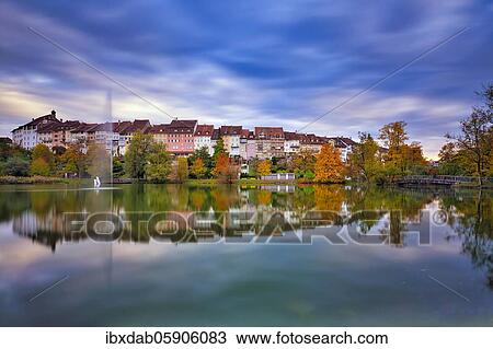 Reflection of the old town of Wil in the pond of the municipal park, thunderclouds at the blue hour, Canton St. Gallen, Switzerland, Europe View Large Photo Image Stock Image - Reflection of the old town of Wil in the pond of the municipal park, thunderclouds at the blue hour, Canton St. Gallen, Switzerland, Europe. Fotosearch