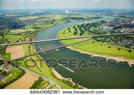 Rheinbogen, Rhine between Duisburg-Baerl and Beeckerwerth, railway bridge and A42 motorway bridge, Duisburg, Ruhr Area, North Rhine-Westphalia, Germany, Europe View Large Photo Image Stock Image - Rheinbogen, Rhine between Duisburg-Baerl and Beeckerwerth, railway bridge and A42 motorway bridge, Duisburg, Ruhr Area, North Rhine-Westphalia, Germany, Europe. Fotosearch