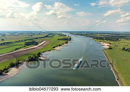 Rhine near Emmerich with cargo ships, inland navigation, Rhine landscape, Emmerich, Lower Rhine, North Rhine-Westphalia, Germany, Europe View Large Photo Image Stock Image - Rhine near Emmerich with cargo ships, inland navigation, Rhine landscape, Emmerich, Lower Rhine, North Rhine-Westphalia, Germany, Europe. Fotosearch