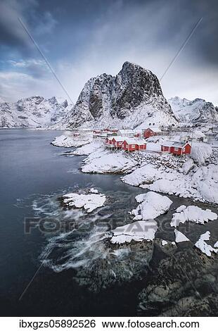 Stock Photograph - Rorbuer fishermen's cabins on the snowy fjord, village view of the fishing village Hamnoy, Hamnøya, Moskenesøy, Nordland, Lofoten, Norway, Europe. Fotosearch