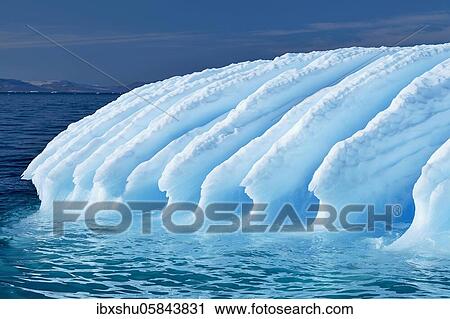 Stock Image - Rugged iceberg drifting through Icefjord, UNESCO World Heritage Site, Disko Bay, Ilulissat, West Greenland, Greenland, North America. Fotosearch