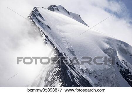 Stock Photo - Rugged mountain peaks, Großer Möseler with Furtschaglkees glacier, snow-covered mountains, high alpine landscape in fog, Berliner Höhenweg, Zillertal Alps, Zillertal, Tyrol, Austria, Europe. Fotosearch