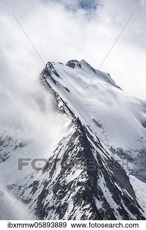 Rugged mountain peaks, Großer Möseler, snow-covered mountains, high alpine landscape in fog, Berliner Höhenweg, Zillertaler Alps, Zillertal, Tyrol, Austria, Europe View Large Photo Image Stock Photo - Rugged mountain peaks, Großer Möseler, snow-covered mountains, high alpine landscape in fog, Berliner Höhenweg, Zillertaler Alps, Zillertal, Tyrol, Austria, Europe. Fotosearch