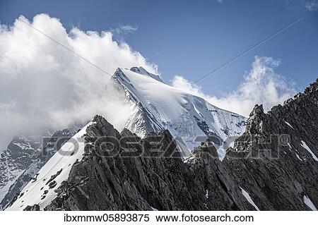 Stock Photography - Rugged mountain peaks, Großer Möseler with Furtschaglkees glacier, in front Furtschaglspitze, snow-covered mountains, high alpine landscape in fog, Berliner Höhenweg, Zillertaler Alps, Zillertal, Tyrol, Austria, Europe. Fotosearch
