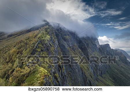 Stock Photo - Rugged mountain range with cloud bank in the summit area, Gildeskål, Nordland, Lofoten, Norway, Europe. Fotosearch