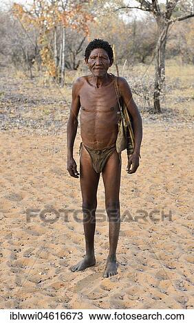 Stock Image - San Man with hunting equipment, Bushman tribe, Kalahari, Namibia, Africa. Fotosearch