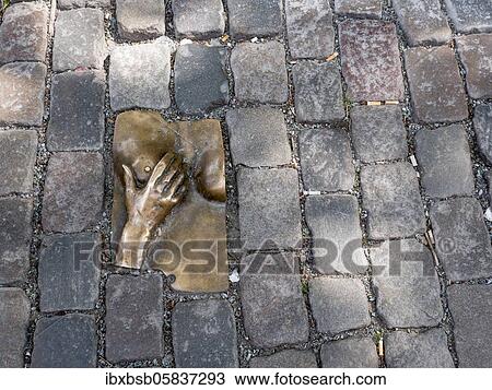 Sculpture between cobblestones in the Oudekerksplein, Amsterdam, Netherlands View Large Photo Image Stock Image - Sculpture between cobblestones in the Oudekerksplein, Amsterdam, Netherlands. Fotosearch