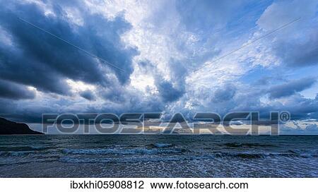 Sea and dramatic cloudy sky, blue hour in the bay Beau Vallon, Mahe Island, Seychelles, Africa View Large Photo Image Stock Image - Sea and dramatic cloudy sky, blue hour in the bay Beau Vallon, Mahe Island, Seychelles, Africa. Fotosearch