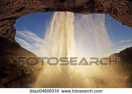Seljalandsfoss waterfall in the back light, Seljalandsa river, South Island, Island View Large Photo Image Stock Photograph - Seljalandsfoss waterfall in the back light, Seljalandsa river, South Island, Island. Fotosearch