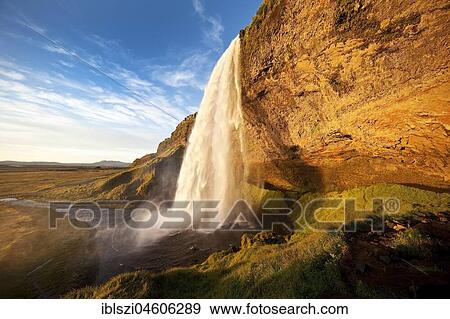 Seljalandsfoss waterfall in the evening light, Seljalandsa river, South Island, Island View Large Photo Image Stock Photo - Seljalandsfoss waterfall in the evening light, Seljalandsa river, South Island, Island. Fotosearch