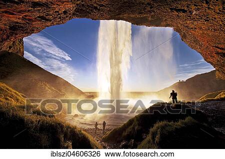 Seljalandsfoss waterfall in the background with people, Seljalandsa river, South Island, Island View Large Photo Image Stock Photograph - Seljalandsfoss waterfall in the background with people, Seljalandsa river, South Island, Island. Fotosearch