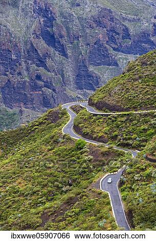 Stock Photograph - Serpentine road in the Teno Mountains near the mountain village Masca, Masca Gorge, Teno Mountains, Tenerife, Canary Islands, Spain, Europe. Fotosearch