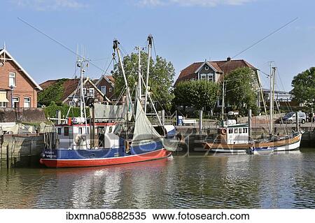 Ships in the North Sea port of Neuharlingersiel, East Frisia, Lower Saxony, Germany, Europe View Large Photo Image Stock Photography - Ships in the North Sea port of Neuharlingersiel, East Frisia, Lower Saxony, Germany, Europe. Fotosearch