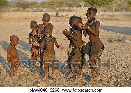 Singing and dancing happy Himbakinders, Kaokoveld, Kunene, Namibia, Africa View Large Photo Image Stock Photo - Singing and dancing happy Himbakinders, Kaokoveld, Kunene, Namibia, Africa. Fotosearch