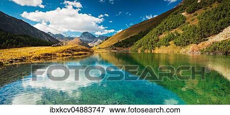 Stock Photo - Small mountain lake on the Albula Pass in autumn, Canton Graubünden, Switzerland, Europe. Fotosearch