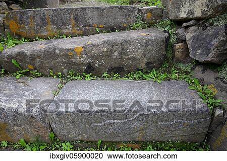 Stock Image - Snake representation on a step in the ruins of Chavín de Huántar, Unesco World Heritage Site, near Huaraz, Ancash Region, Peru, South America. Fotosearch