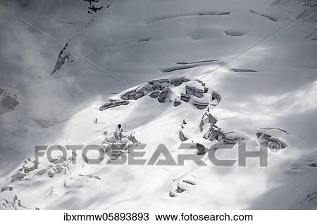 Stock Image - Snow-covered glacier Waxeggkees, high alpine landscape in fog, Berliner Höhenweg, Zillertaler Alps, Zillertal, Tyrol, Austria, Europe. Fotosearch