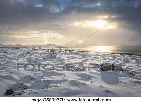 Snowy landscape at sea and fjord, cloud atmosphere, warm sunlight, Nordland, Lofoten, Norway, Europe View Large Photo Image Stock Photo - Snowy landscape at sea and fjord, cloud atmosphere, warm sunlight, Nordland, Lofoten, Norway, Europe. Fotosearch