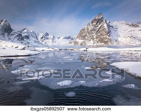 Stock Photo - Snowy landscape by the fjord, Hamnoy, Nordland, Lofoten, Norway, Europe. Fotosearch