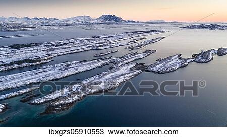 Snowy mountain range Seven Sisters, De syv søstre, Sju søstre, front winter archipelago islands in the sea, Dønna, Nordland, Norway, Europe View Large Photo Image Stock Image - Snowy mountain range Seven Sisters, De syv søstre, Sju søstre, front winter archipelago islands in the sea, Dønna, Nordland, Norway, Europe. Fotosearch