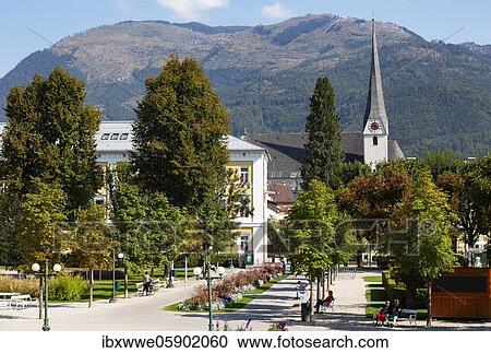 Stock Image - Spa gardens with the parish church of St. Nicholas, Bad Ischl, Salzkammergut, Upper Austria, Austria, Europe. Fotosearch