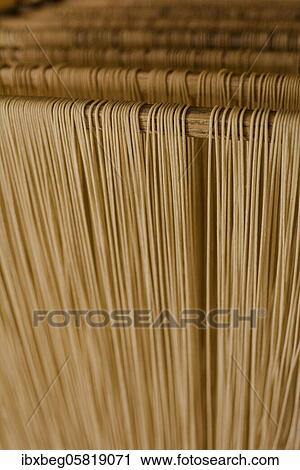 Stock Image - Spaghetti, noodle production. Fotosearch