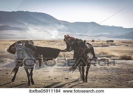 Spai Bashakhan's sons train for the Mongolian equestrian game Buzkaschi, Olgii Province, Mongolia, Asia View Large Photo Image Picture - Spai Bashakhan's sons train for the Mongolian equestrian game Buzkaschi, Olgii Province, Mongolia, Asia. Fotosearch