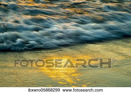 Spray, waves on the beach, sunset, long exposure, dynamic range, Porth Nanven, St. Just, Cornwall, Great Britain View Large Photo Image Stock Photo - Spray, waves on the beach, sunset, long exposure, dynamic range, Porth Nanven, St. Just, Cornwall, Great Britain. Fotosearch