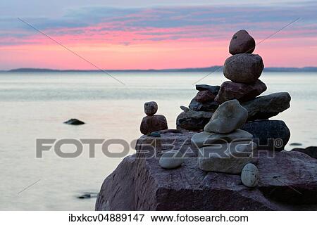 Stone pyramids on the beach at sunset, Mönchgut peninsula, Rügen Island, Mecklenburg-Western Pomerania, Germany, Europe View Large Photo Image Stock Photo - Stone pyramids on the beach at sunset, Mönchgut peninsula, Rügen Island, Mecklenburg-Western Pomerania, Germany, Europe. Fotosearch