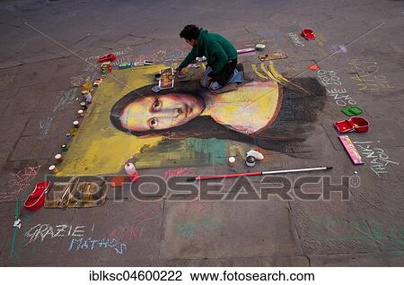 Street artist paints the Mona Lisa by Leonardo da Vinci with chalk on the asphalt, Siena, Italy, Europe View Large Photo Image Stock Image - Street artist paints the Mona Lisa by Leonardo da Vinci with chalk on the asphalt, Siena, Italy, Europe. Fotosearch
