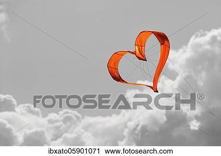 Sunlit heart-shaped dragon, orange heart in front of grey sky, North Rhine-Westphalia, Germany, Europe View Large Photo Image Stock Image - Sunlit heart-shaped dragon, orange heart in front of grey sky, North Rhine-Westphalia, Germany, Europe. Fotosearch