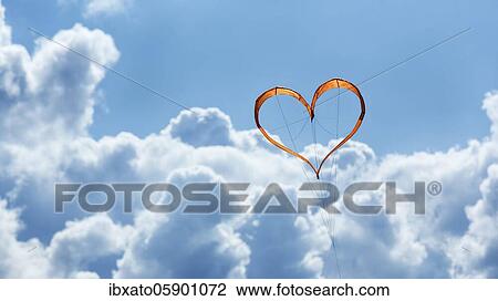 Sunlit heart-shaped dragon, orange heart in front of blue sky, North Rhine-Westphalia, Germany, Europe View Large Photo Image Stock Image - Sunlit heart-shaped dragon, orange heart in front of blue sky, North Rhine-Westphalia, Germany, Europe. Fotosearch