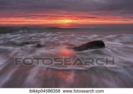 Sunrise over the sea, surf on the Baltic Sea coast near Sassnitz, Rügen, Mecklenburg-Western Pomerania, Germany, Europe View Large Photo Image Stock Photo - Sunrise over the sea, surf on the Baltic Sea coast near Sassnitz, Rügen, Mecklenburg-Western Pomerania, Germany, Europe. Fotosearch