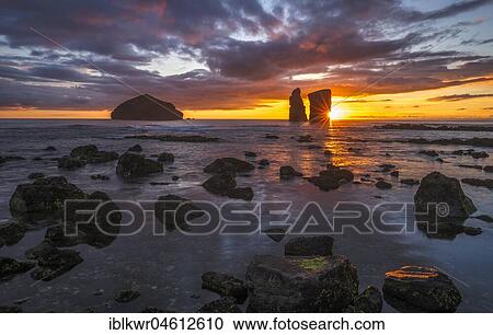 Sunset behind rock formation on the beach of Mosteiros on the west coast of Sao Miguel, Azores, Portugal, Europe View Large Photo Image Stock Image - Sunset behind rock formation on the beach of Mosteiros on the west coast of Sao Miguel, Azores, Portugal, Europe. Fotosearch