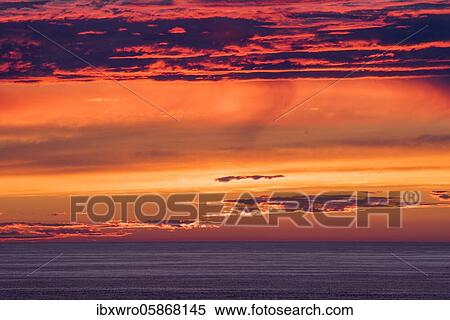 Stock Photography - Sunset by the sea at Cape Cornwall, Celtic Sea, Cornwall, England, Great Britain. Fotosearch