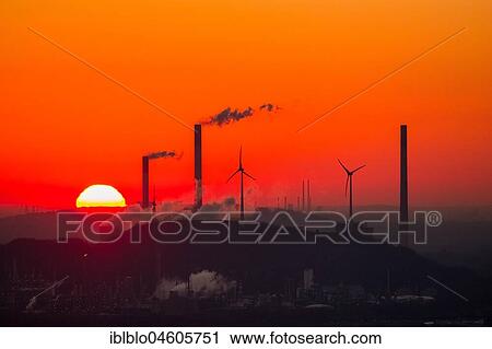 Sunset in front of Scholven power plant, Uniper power plants, red sky, chimneys, wind power plants, Halde Oberscholven wind farm, Gelsenkirchen, Ruhr Area, North Rhine-Westphalia, Germany, Europe View Large Photo Image Stock Image - Sunset in front of Scholven power plant, Uniper power plants, red sky, chimneys, wind power plants, Halde Oberscholven wind farm, Gelsenkirchen, Ruhr Area, North Rhine-Westphalia, Germany, Europe. Fotosearch