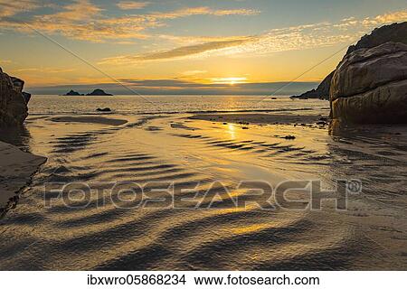 Sunset on the rocky coast at Porth Nanven, St. Just, Cornwall, Great Britain View Large Photo Image Picture - Sunset on the rocky coast at Porth Nanven, St. Just, Cornwall, Great Britain. Fotosearch