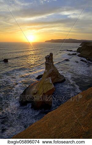 Sunset over the rock Catedral, Playa Supay, Paracas National Reserve, Paracas, Ica Region, Peru, South America View Large Photo Image Picture - Sunset over the rock Catedral, Playa Supay, Paracas National Reserve, Paracas, Ica Region, Peru, South America. Fotosearch