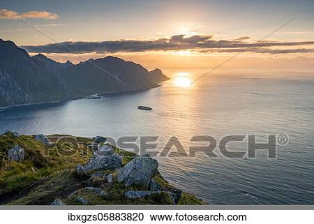 Sunset over the sea, mountain tops, Offersoykammen, Vestvågøy, Lofoten, Nordland, Norway, Europe View Large Photo Image Stock Image - Sunset over the sea, mountain tops, Offersoykammen, Vestvågøy, Lofoten, Nordland, Norway, Europe. Fotosearch