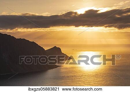Sunset over the sea, mountain tops, Offersoykammen, Vestvågøy, Lofoten, Nordland, Norway, Europe View Large Photo Image Stock Image - Sunset over the sea, mountain tops, Offersoykammen, Vestvågøy, Lofoten, Nordland, Norway, Europe. Fotosearch