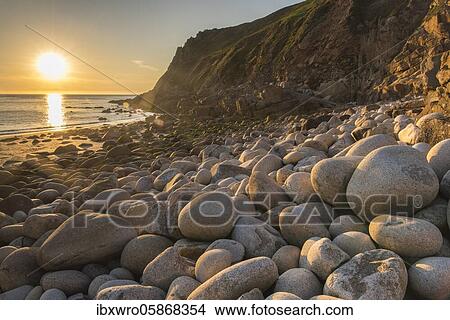 Sunset, rocky coast at Porth Nanven, St. Just, Cornwall, England, Great Britain View Large Photo Image Picture - Sunset, rocky coast at Porth Nanven, St. Just, Cornwall, England, Great Britain. Fotosearch