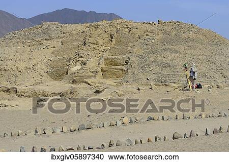 Stock Image - Surveying work in the ruins of Caral, oldest city in America, Unesco World Heritage Site, Rio Supe Valley, Peru, South America. Fotosearch