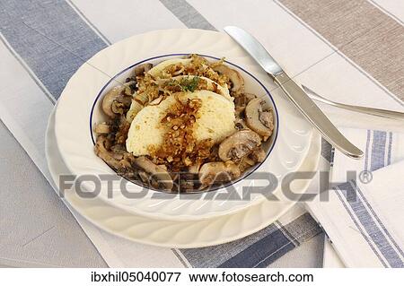 Swabian cuisine, steamed noodle on mushroom ragout arranged on plate, knife, Germany, Europe View Large Photo Image Stock Photo - Swabian cuisine, steamed noodle on mushroom ragout arranged on plate, knife, Germany, Europe. Fotosearch