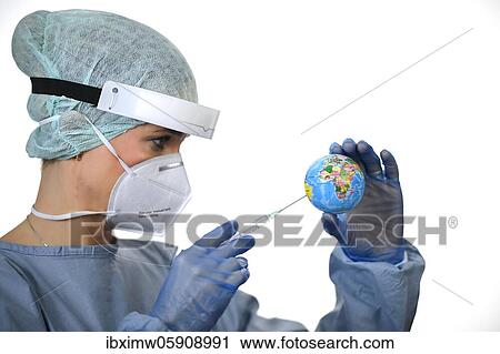 Stock Image - Symbol image Corona vaccine, doctor with syringe, corona crisis, Baden-Württemberg, Germany, Europe. Fotosearch