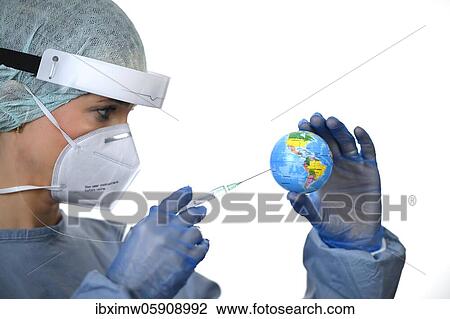 Stock Image - Symbol image Corona vaccine, doctor with syringe, corona crisis, Baden-Württemberg, Germany, Europe. Fotosearch