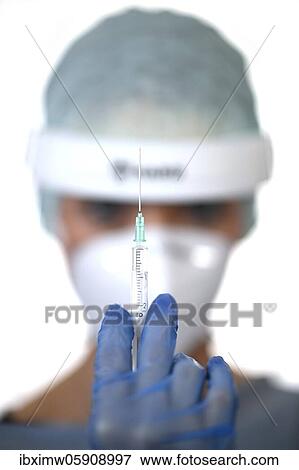 Symbol image Corona vaccine, doctor with syringe, corona crisis, Baden-Württemberg, Germany, Europe View Large Photo Image Stock Photo - Symbol image Corona vaccine, doctor with syringe, corona crisis, Baden-Württemberg, Germany, Europe. Fotosearch