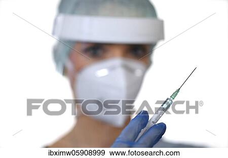 Symbol image Corona vaccine, doctor with syringe, corona crisis, Baden-Württemberg, Germany, Europe View Large Photo Image Stock Photo - Symbol image Corona vaccine, doctor with syringe, corona crisis, Baden-Württemberg, Germany, Europe. Fotosearch